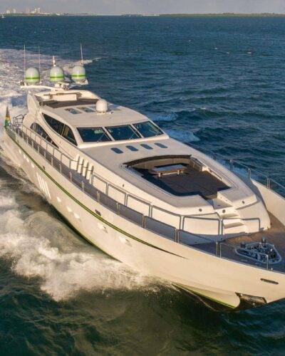 Private yacht cruising at sunset on calm blue water