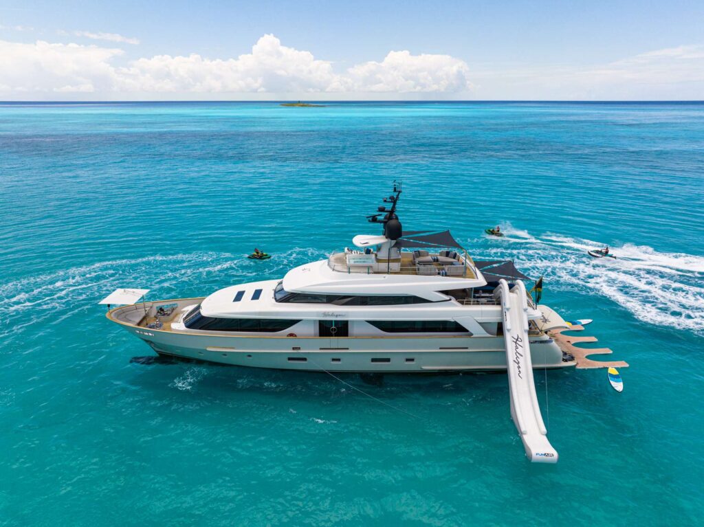 Vibrant 7466 yacht with bright hull color cruising.
