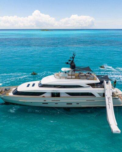 Vibrant 7466 yacht with bright hull color cruising.