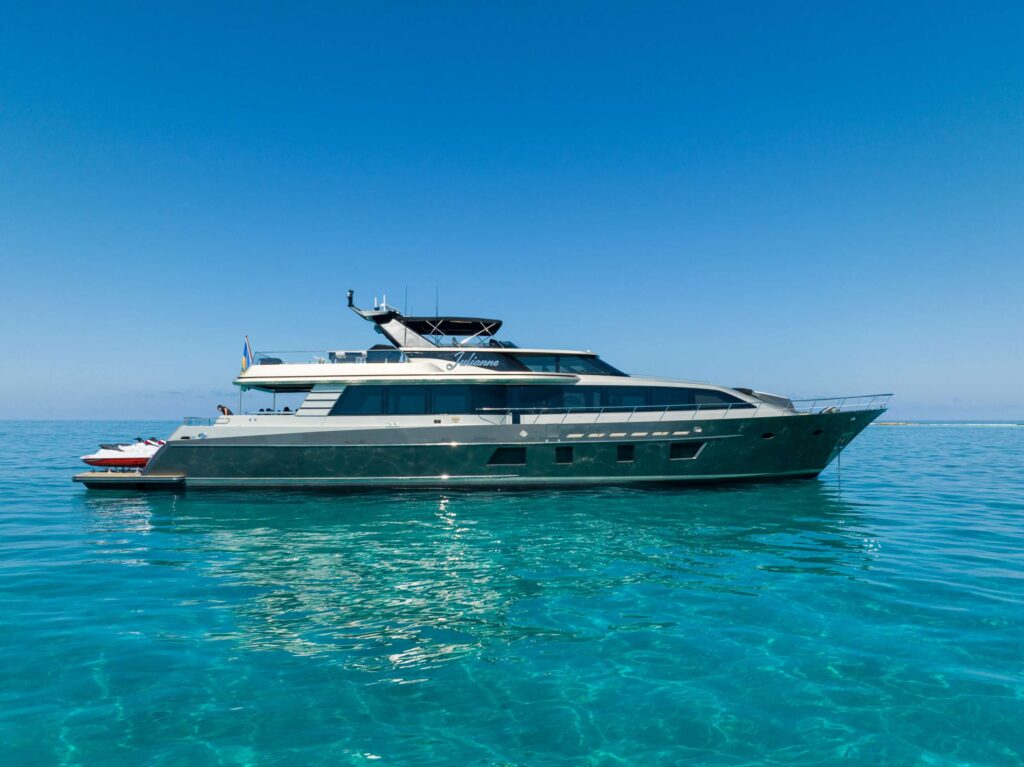Sleek 7645 yacht, contemporary lines on calm ocean.