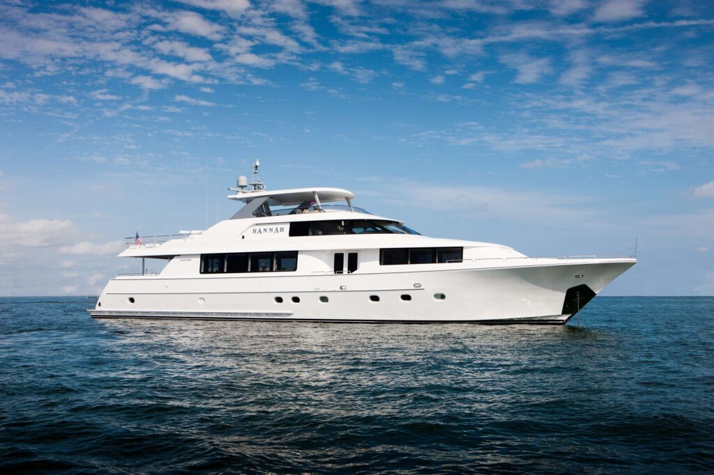 Spacious 8080 luxury yacht with outdoor dining area.